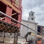 five story condo goes up to the north sandwiching Chestnut Hill Baptist Church between a multi-story condo to the south
